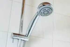 chrome shower head with running water