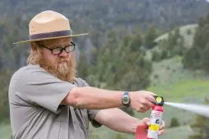 Man Spraying Bear Spray