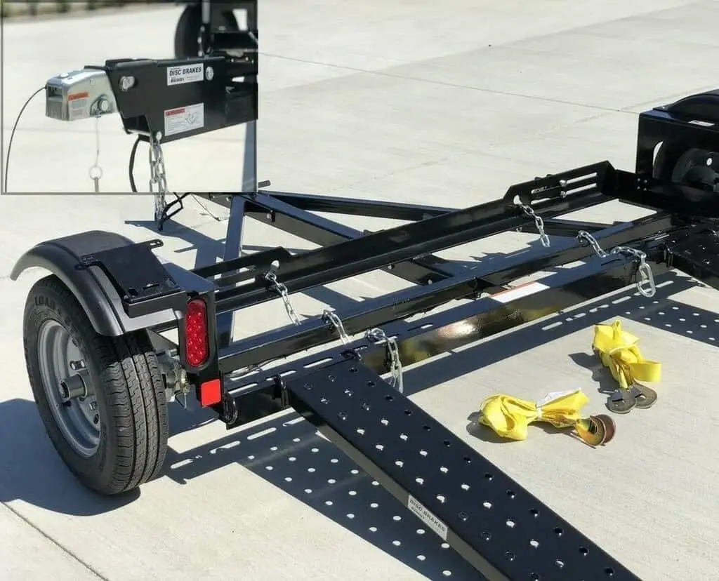 A closeup view of an RV tow dolly used for towing a car behind an RV
