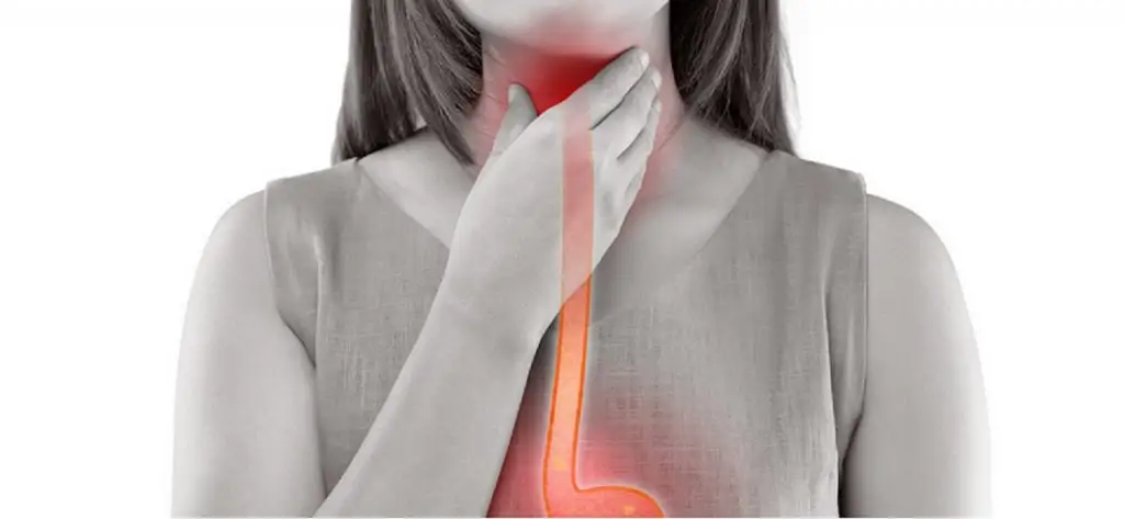 Woman holding her throat with a red graphic showing her esophagus
