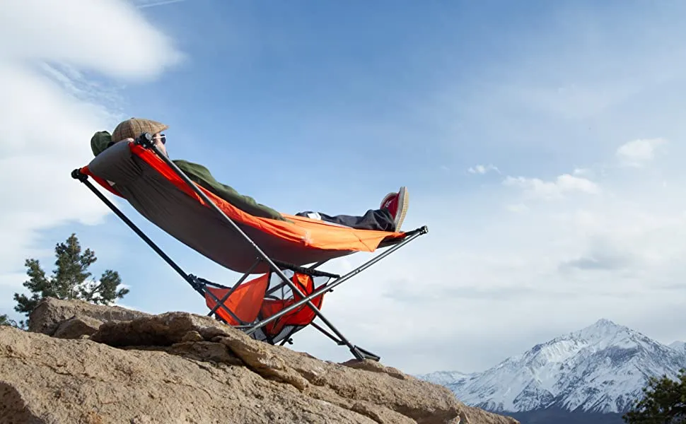 Man laying in a camping hammock