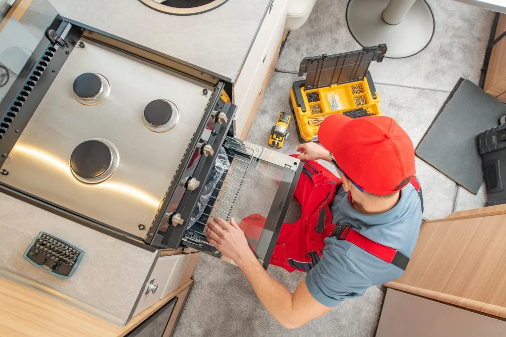 RV tech servicing RV oven - RV service and repair
