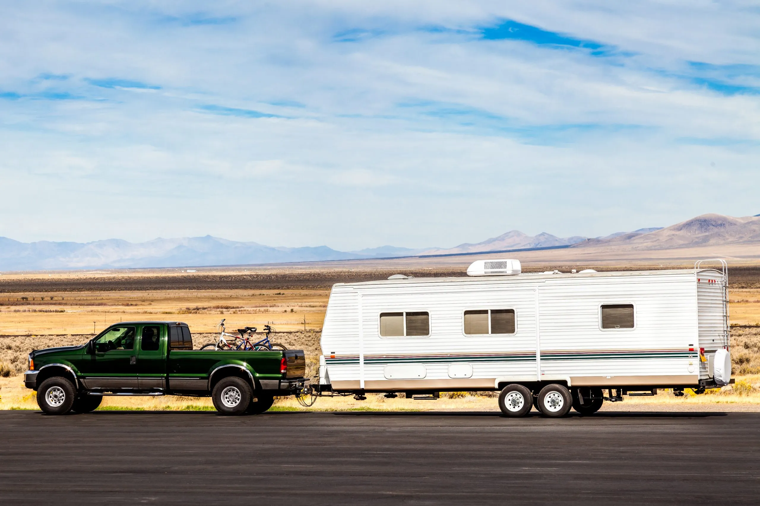 Truck hitched to long trvel trailer