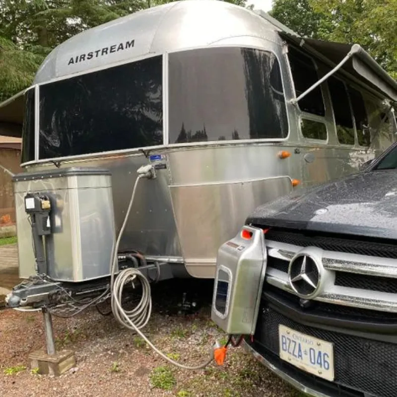 CarGenerator connected between an SUV and an Airstream