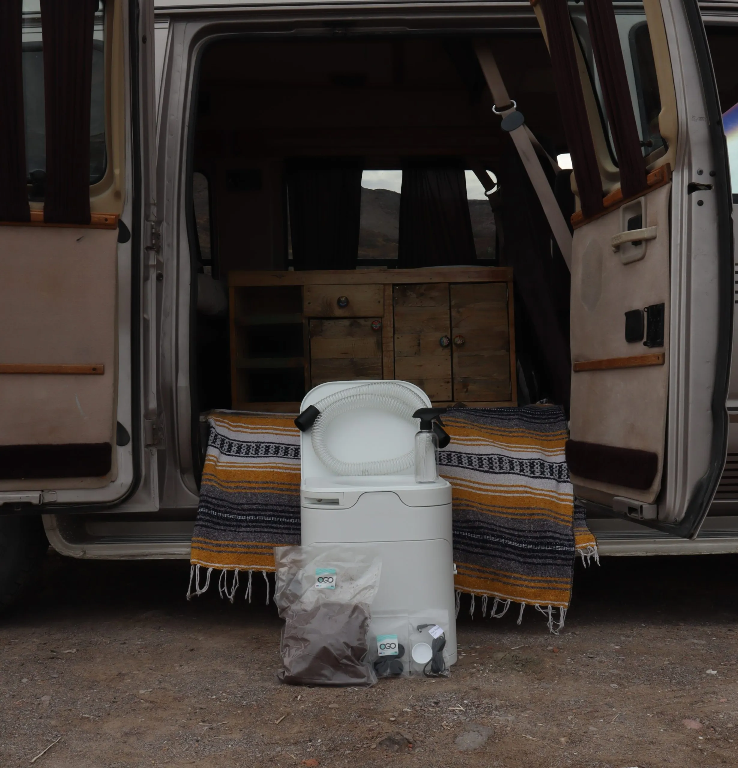 Compost toilet in front of a camper van