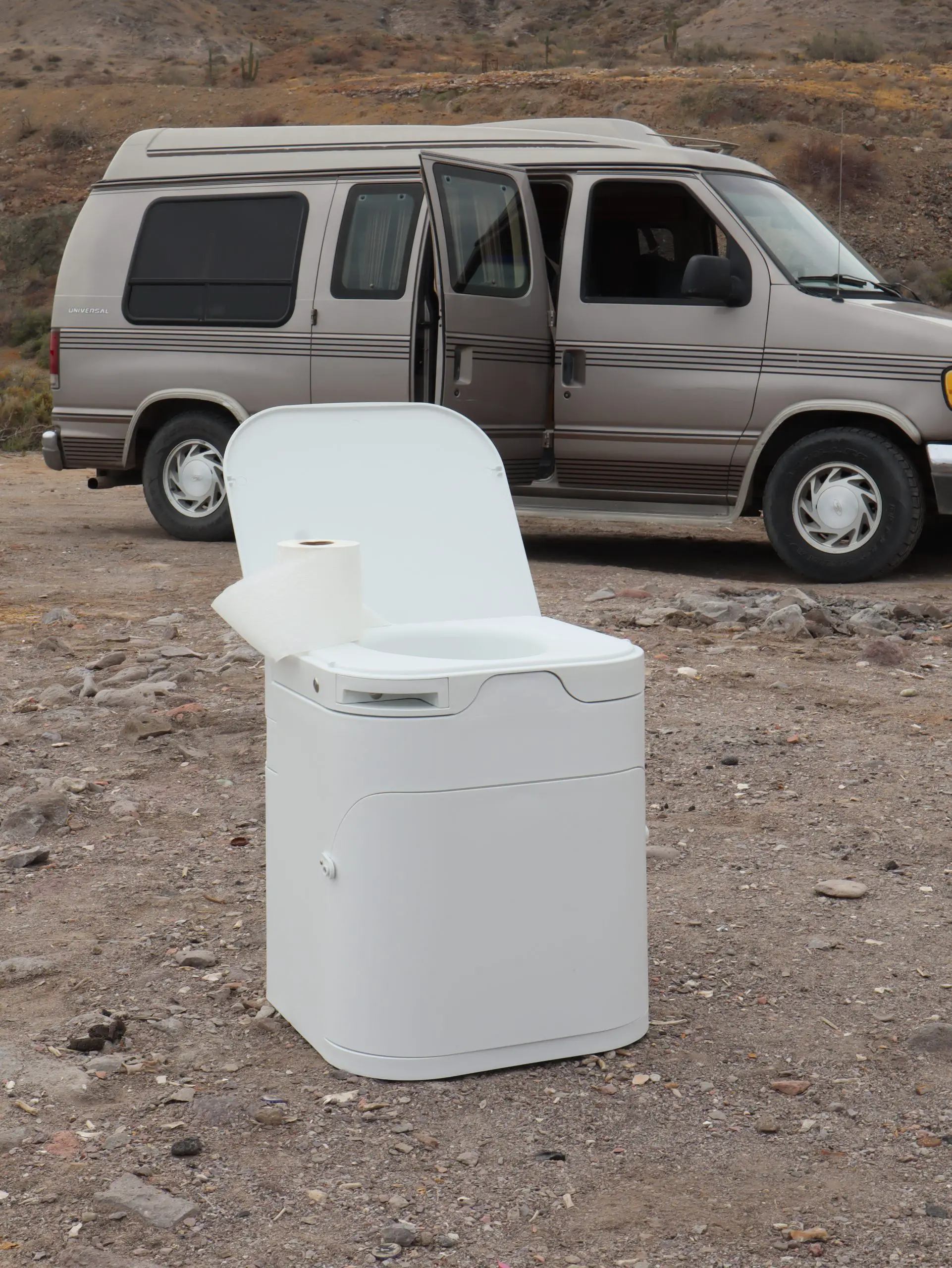 OGO Compost Toilet sitting in front of camper van